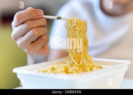 harmful fast food. instant noodles brewed in boiling water Stock Photo