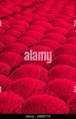 Colourful bundles of incense at an incense factory in Hanoi, Vietnam Stock Photo