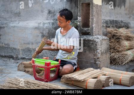 Man making incense sticks at Quang Phu Cau Incense Village  in Hanoi, Vietnam Stock Photo