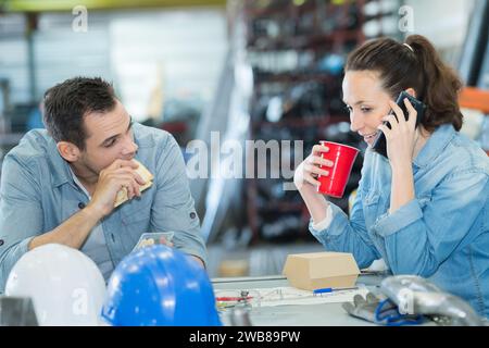 woman using her phone during lunch break Stock Photo
