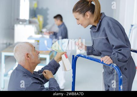 young apprentice painter in professional training Stock Photo