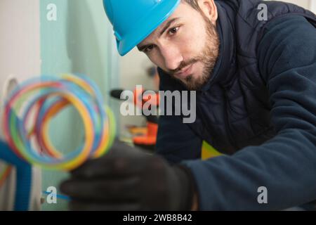 electrician engineer tests electrical installations Stock Photo