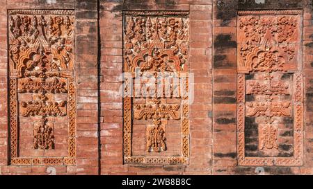 Closeup view of ancient terracotta decor with floral and geometric pattern on exterior brick wall of Sura mosque, Ghoraghat, Dinajpur, Bangladesh Stock Photo