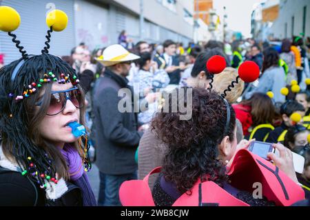 Barcelona, Spain, February 13, 2015 - School carnival brings together parents and children in a vibrant neighborhood parade, showcasing creative costu Stock Photo