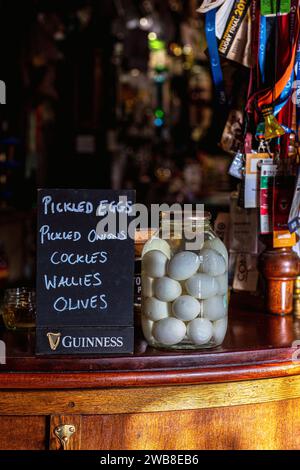 Mason jar filled with old fashioned pickled eggs Stock Photo