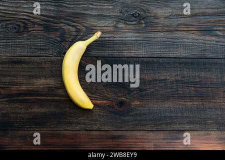 two banana on a wooden table. Empty copy space for editor's text. Stock Photo