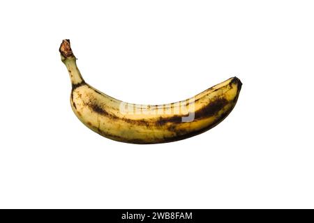 Rotten Banana with spots on isolated white background Stock Photo