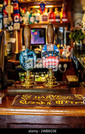 Beer pump handles at The Plume of Feathers , London, Greenwich, UK Stock Photo
