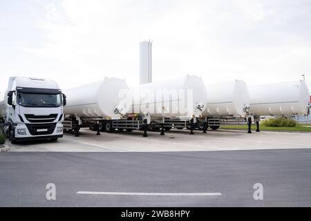 Tank trailers stand in a row. LPG transportation. Stock Photo