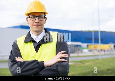 Portrait of engineer in helmet and glasses. Stock Photo