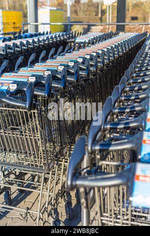 Hockenheim, Germany - 03rd, January 2024: Aldi supermarket shopping trolleys. Aldi is a German supermarket chain Stock Photo