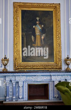 Portrait of Shah Nasser ed Din in full royal dress displayed in the Ivory Hall of Golestan Palace, royal residence of the Qajar dynasty. Tehran, Iran. Stock Photo