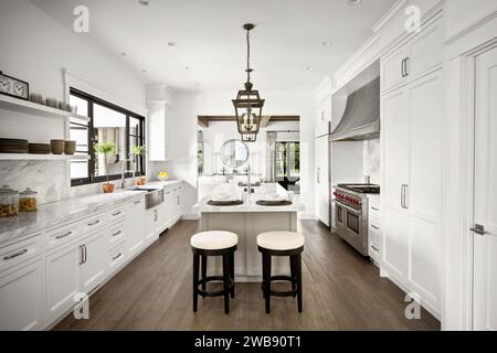 A modern kitchen with an island countertop featuring barstools and a sleek design Stock Photo