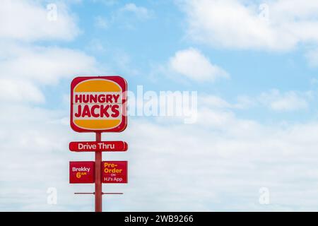 Tailem Bend, South Australia - October 13, 2023: Hungry Jack's with drive thru street sign logo viewed from the highway on a day Stock Photo