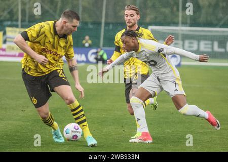Dortmund's Niklas Sule and Standard's Romaine Mundle fight for the ball during a friendly soccer match between Standard de Liege and German Bundesliga team Borussia Dortmund during the winter training camp of Belgian soccer team Standard de Liege, in Marbella, Spain, Tuesday 09 January 2024. BELGA PHOTO BRUNO FAHY Stock Photo