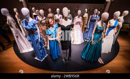 London, UK. 9th Jan, 2024. The 'Revenge dress', custom-made  off-the-shoulder black cocktail dress. Worn by Elizabeth Debicki (as Princess  Diana) in Season 5 Episode 5. Estimate: 8,000-12,000 with some of the many  other dresses- A preview of The ...