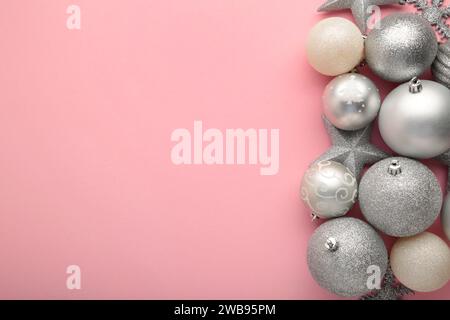 Christmas decoration with Christmas silver balls on pink background with copy space. Top view Stock Photo