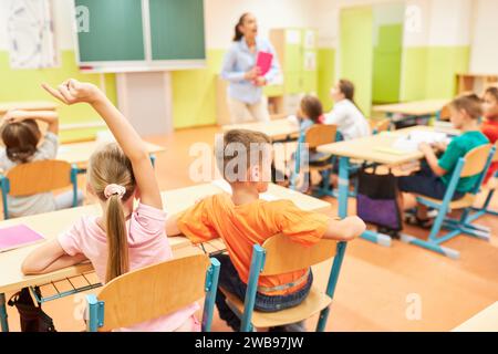 Children sitting in the classroom and studying Stock Photo - Alamy