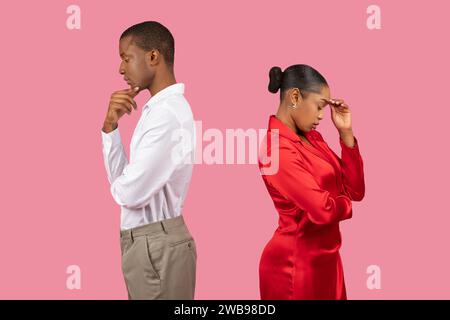 Black man and woman thinking back to back Stock Photo - Alamy