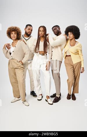 african american men and woman in casual attire standing on grey background, Juneteenth concept Stock Photo