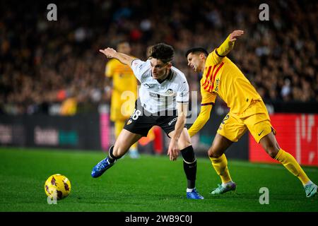 Pepelu, Spanish player of Valencia CF stealing a ball from FC Barcelona's Joao Cancelo during a league match at the Mestalla stadium, Valencia, Spain. Stock Photo