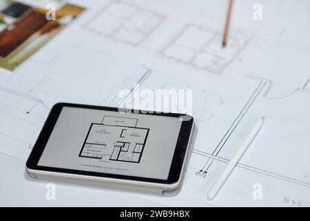 Apartment plan on screen of digital tablet, architecture and interior design concept Stock Photo