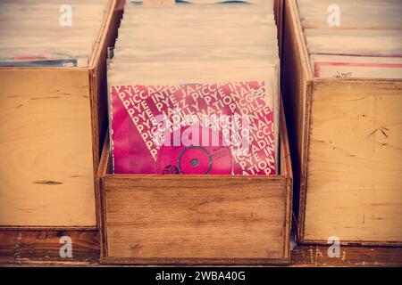 Den Bosch, The Netherlands - May 12, 2019: Wooden boxes with vinyl turntable records on an antique fifties to seventies flea market in Den Bosch Stock Photo