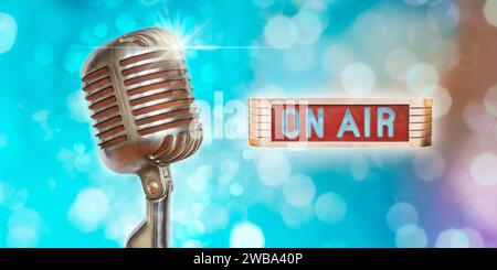 Vintage microphone with on air illuminated sign on a colorful background Stock Photo