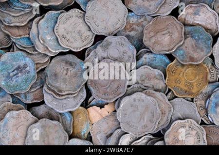 Indian Old vintage coins, vintage coin abstract with English & Indian coins in forefront. Stock Photo