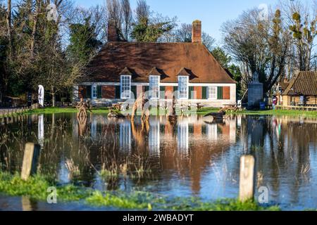 Berkshire, England. 09/01/2024, Road and National Trust tea room carpark, covered by floodwater from river Thames in Old Windsor and Runnymede Berkshire Credit: Ian Skelton/Alamy Live News Stock Photo