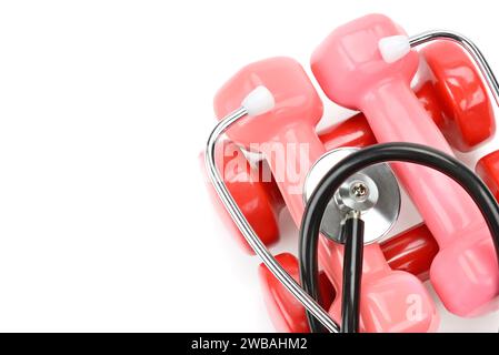Set of dumbbells and stethoscope isolated on white background. Sports equipment. Health care concept. Free space for text. Stock Photo