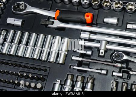 Tool box, tool kit closeup with set of hex, torx and screwdriver bits and ratchet wrench sockets Stock Photo