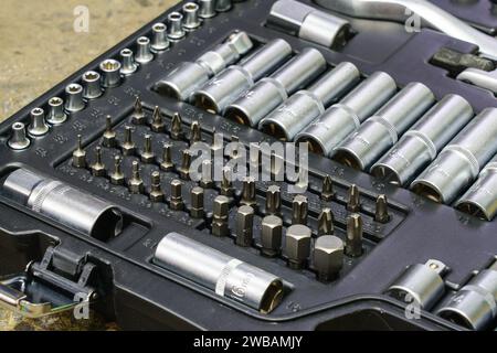 Tool box, tool kit closeup with set of hex, torx and screwdriver bits and ratchet heads Stock Photo