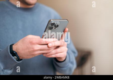 holding cellphone in hands. texting message, scrolling Stock Photo