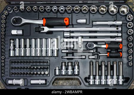 Universal tool box, tool kit with set of hex, torx and screwdriver bits and ratchet wrench sockets Stock Photo