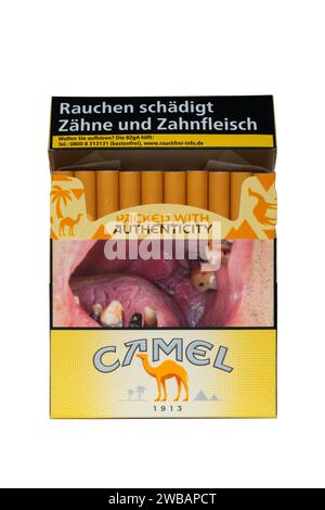 packet of fifty five german camel yellow cigarettes with graphic health warning picture on the front cut out on white background Stock Photo