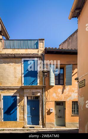 Arles, France, Sept 9th 2023, view of some ochre wall houses in Girard Le Bleu Street Stock Photo