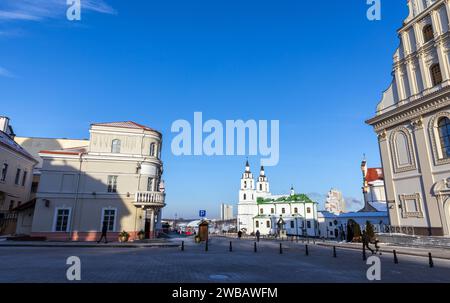 Minsk, Belarus - January 7, 2024: Street view with Freedom Square on a winter day, ordinary people walk the street Stock Photo