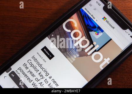 Vancouver, CANADA - Jan 8 2024 : A blog post “Introducing a new Copilot key to kick off the year of AI-powered Windows PCs” seen in an iPhone. Stock Photo