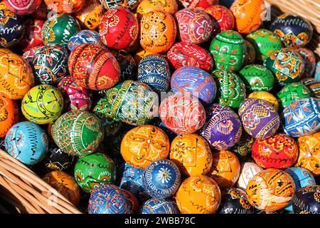 Traditional Czech easter eggs for sale at a market. Hand painted Easter eggs at a basket. Stock Photo