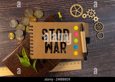 Stop war, handwritten with a chalk on the blackboard. Stock Photo