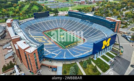 Aerial View of Michigan Stadium with Football Field and Blue Seating Stock Photo