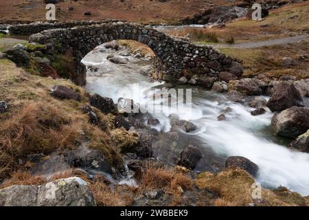 Lingcove Bridge over Lingcove Beck in Upper Eskdale, in the English Lake District Stock Photo