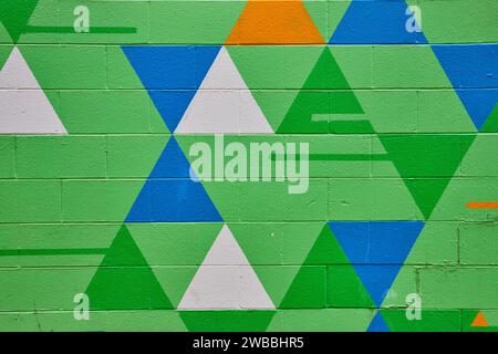 Colorful Geometric Mural Texture, Vibrant Abstract Triangle Pattern Stock Photo
