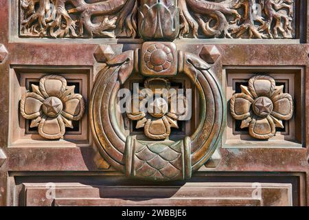 Copper Relief with Nautical Motifs and Floral Patterns - Eye-Level View Stock Photo