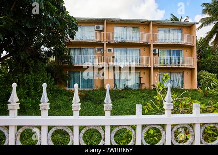 Vintage Tropical Apartment Complex in Nassau with Lush Greenery Stock Photo