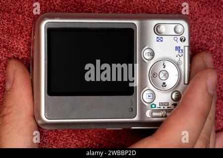 hand holding a vintage camera with copy space on the screen Stock Photo