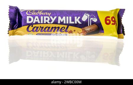 Winneconne, WI - 9 January 2024: A package of Cadbury dairy milk caramel candy bar on an isolated background. Stock Photo