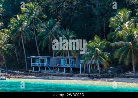 Koh Wai Island Trat Thailand is a tinny tropical Island near Koh Chang. wooden bamboo hut bungalow on the beach on a sunny day Stock Photo