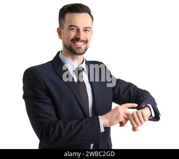 Handsome businessman looking at smartwatch on white background Stock Photo